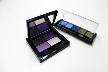 Eye shadow in purple tones on white background.