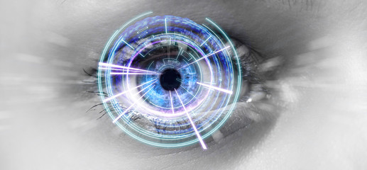 Eye of a woman with digital interface in front of it