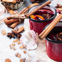 Hot mulled wine in a red mug for winter holidays