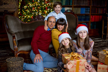 Christmas family of five people, happy parents and their kids