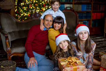 Christmas family of five people, happy parents and their kids
