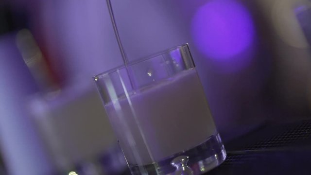 SLO MO CLOSE-UP Bartender preparing cocktail