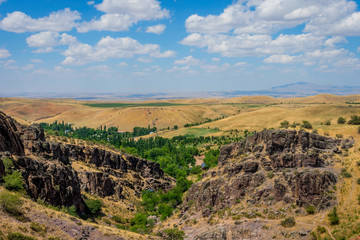 Fototapeta na wymiar Turbat canyon and grasslands behind, Kazakhstan