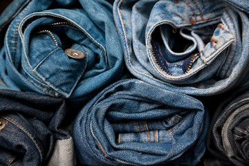 torn jeans stack background blue denim fashion beauty