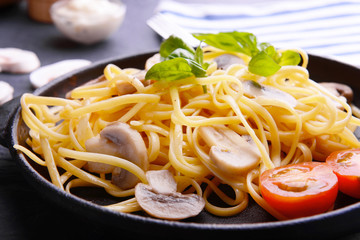 Pasta with mushrooms sauce on plate closeup