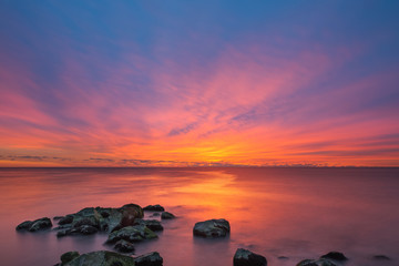 Vibrant Sunrise Seascape from a Jetty 