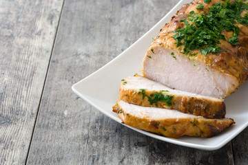Roasted pork on wooden table
