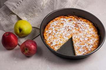 Apple pie with fresh fruits on light marble background