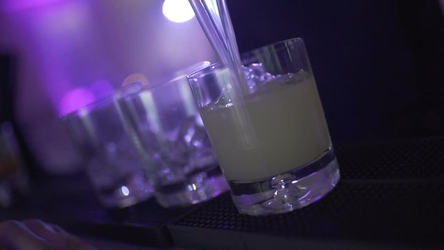 SLO MO CLOSE-UP Bartender preparing cocktail