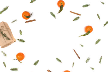 Christmas composition. Christmas frame with tangerines, fir branches, cinnamon sticks, anise star. Flat lay, top view