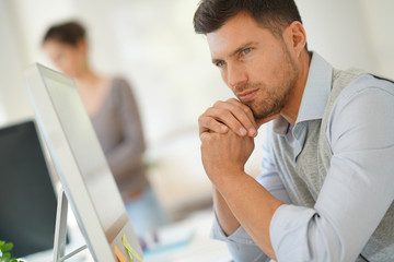 Handsome businessman working for startup company