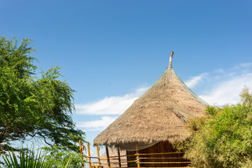 thatch cottage hut with clear sky