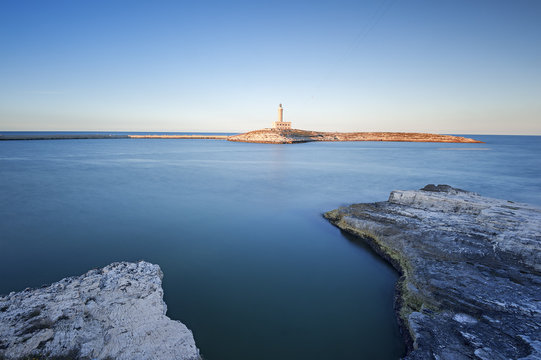 The Vieste lighthouse on the rock of Santa Eufemia, Vieste, Gargano, Apulia, Italy 