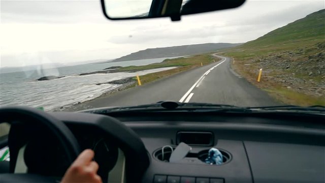 Handheld footage of driving in Iceland. Driving 4x4 on icelandic roads with a beautiful landscape around.