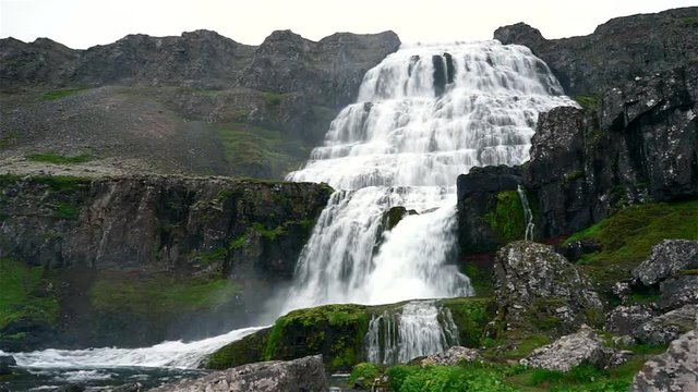 Scenic view of Dynjandi Waterfall, Westfjord, Iceland. Footage of a huge Dynjandi waterfall running in cascades from a mountain.