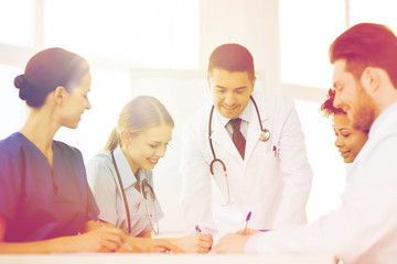 group of happy doctors meeting at hospital office