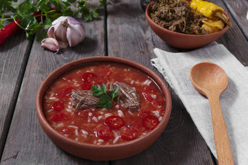 Traditional Georgian soup Kharcho with meat and rice in ceramic ware