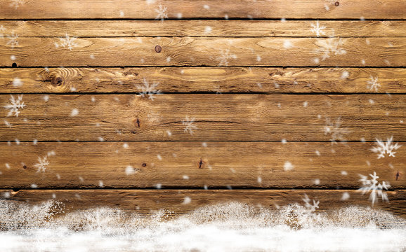 wooden background with snowflakes