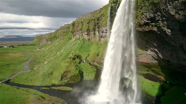 Scenic view of famous Seljalandsfoss waterfall located in South Iceland. Aerial footage of powerful Seljalandsfoss waterfall.