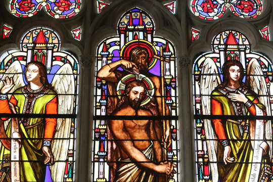 Stained glass window depicting the Baptism of Jesus by John the Baptist, St. Germain l'Auxerrois church, Paris, France 