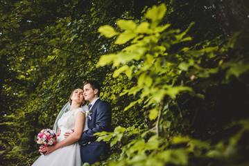 Portrait of bride and groom on the forest