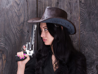 beautiful sexy girl the cowboy with a gun, a criminal