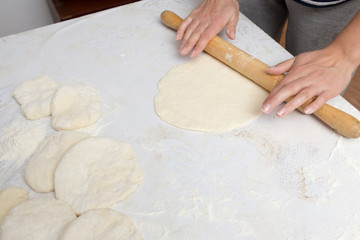 rolling dough with a rolling pin