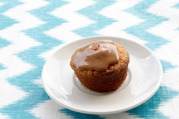 Cake at plate on striped background. Top view.