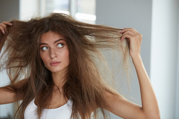 Woman With Holding Long Damaged Dry Hair. Hair Damage, Haircare.