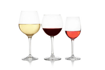 Three glasses with tasty wine on white background