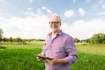 senior man with tablet pc computer at county