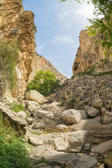 Fototapeta na wymiar Fisheye view on Avakas Gorge with steep rocks and river on bottom. Akamas peninsula, Cyprus. 