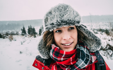 Fototapeta na wymiar Winter vacation concept, young woman portrait.