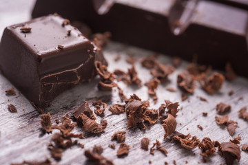 dark chocolate on wood desk