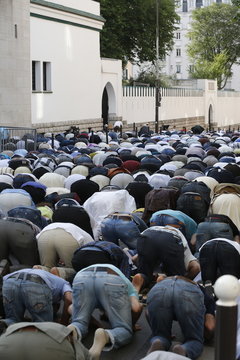 Muslims praying outside the Paris Great Mosque on Eid al-Fitr festival, Paris, France 