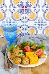 Polenta grill with chicken meatballs and fresh vegetables 