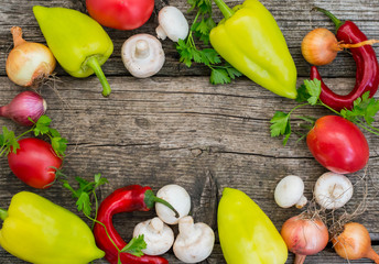 Vegetable set on a wooden background. Top view. Close-up
