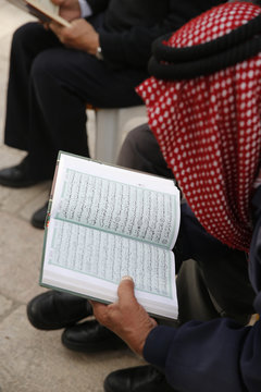 Palestinians reading the Koran outside Al-Aqsa mosque, Jerusalem, Israel
