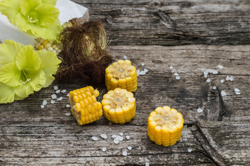 Fresh cobs of corn on the wooden background. Top view. Close-up