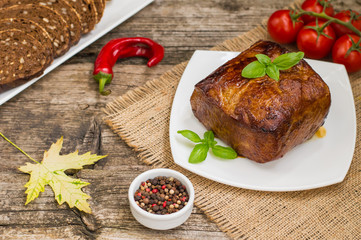 Very tasty cooked beef with spices and vegetables on wooden old table