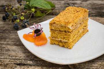 Cake honey  on a wooden background