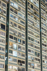 Fototapeta premium Facade of high rise residential building in Hong Kong city at night