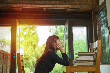 woman reading a book in her living room