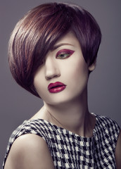 Beautiful woman portrait with fashion haircut and creative trendy make-up