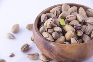 Pistachio nuts on a white table