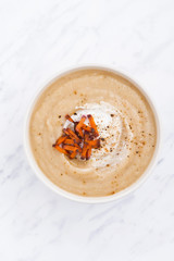 spicy vegetable soup with caramelized carrots, top view vertical