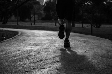 monochrome, young man runner running on the road