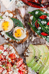 tasty and delicious bruschetta with with vegetables, cheese and micro greens