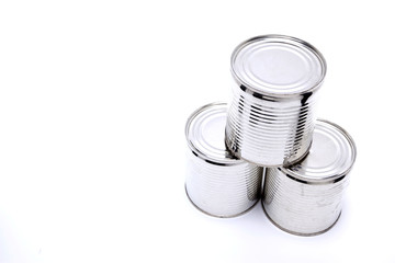 Three tall cans in white background.