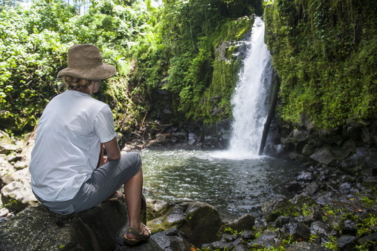 Woman looking at the Nikotoapw waterfall, Pohnpei (Ponape), Federated States of Micronesia, Caroline Islands, Central Pacific 